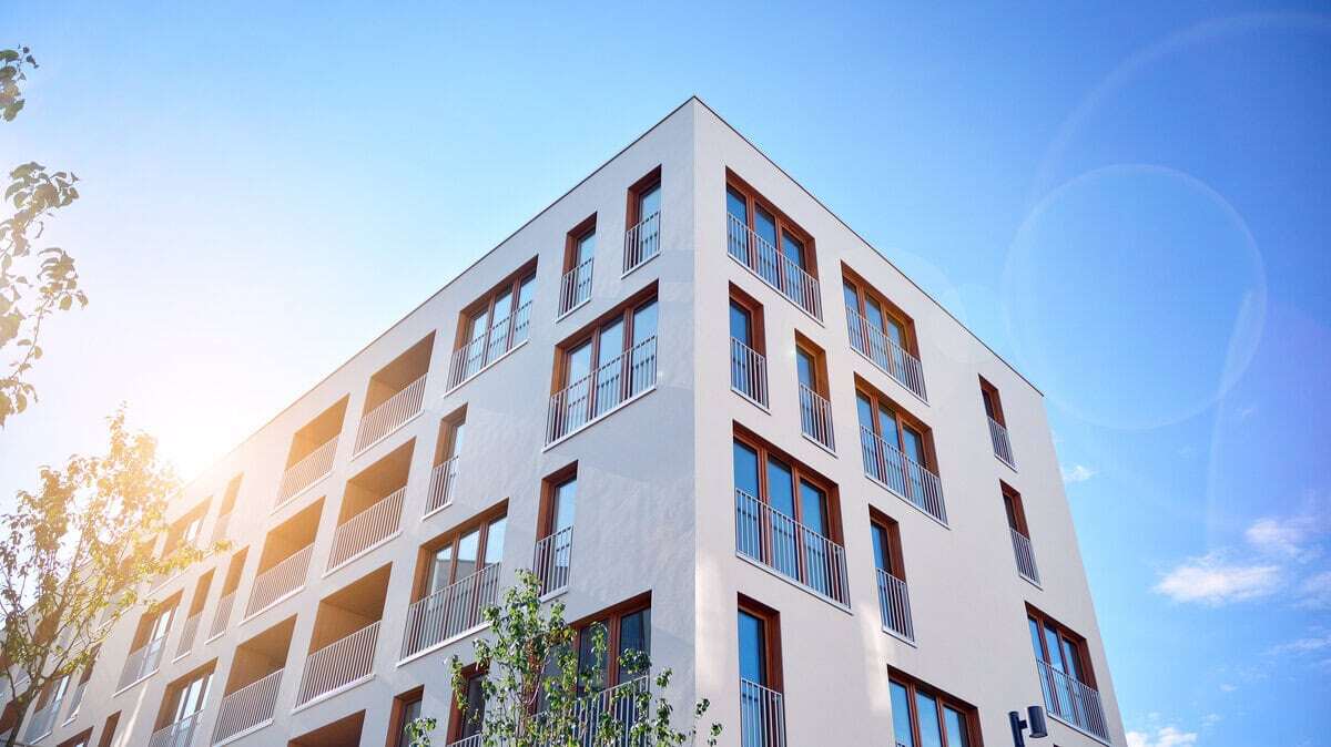 modern apartment building sunny sky